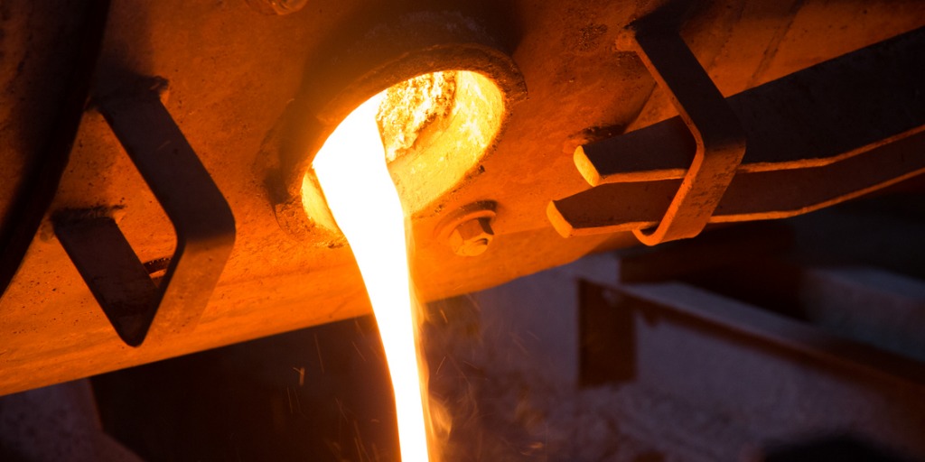 Molten glass pouring out of a furnace